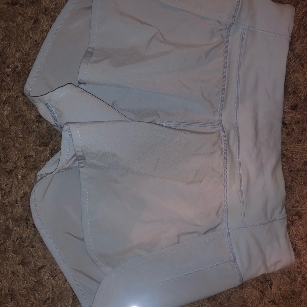 LIGHT BLUE LULU SHORTS SIZE 4
